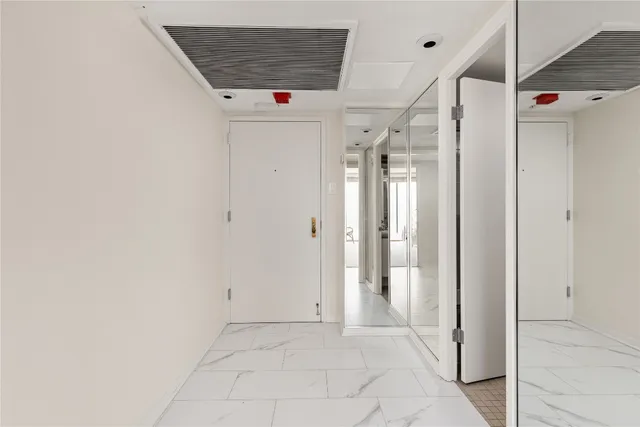 a view of a hallway with a shower