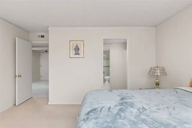 a bedroom with a bed and a mirror