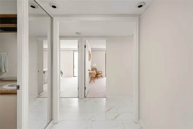 a bathroom with a shower and closet