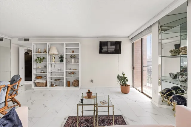 a living room with furniture and windows