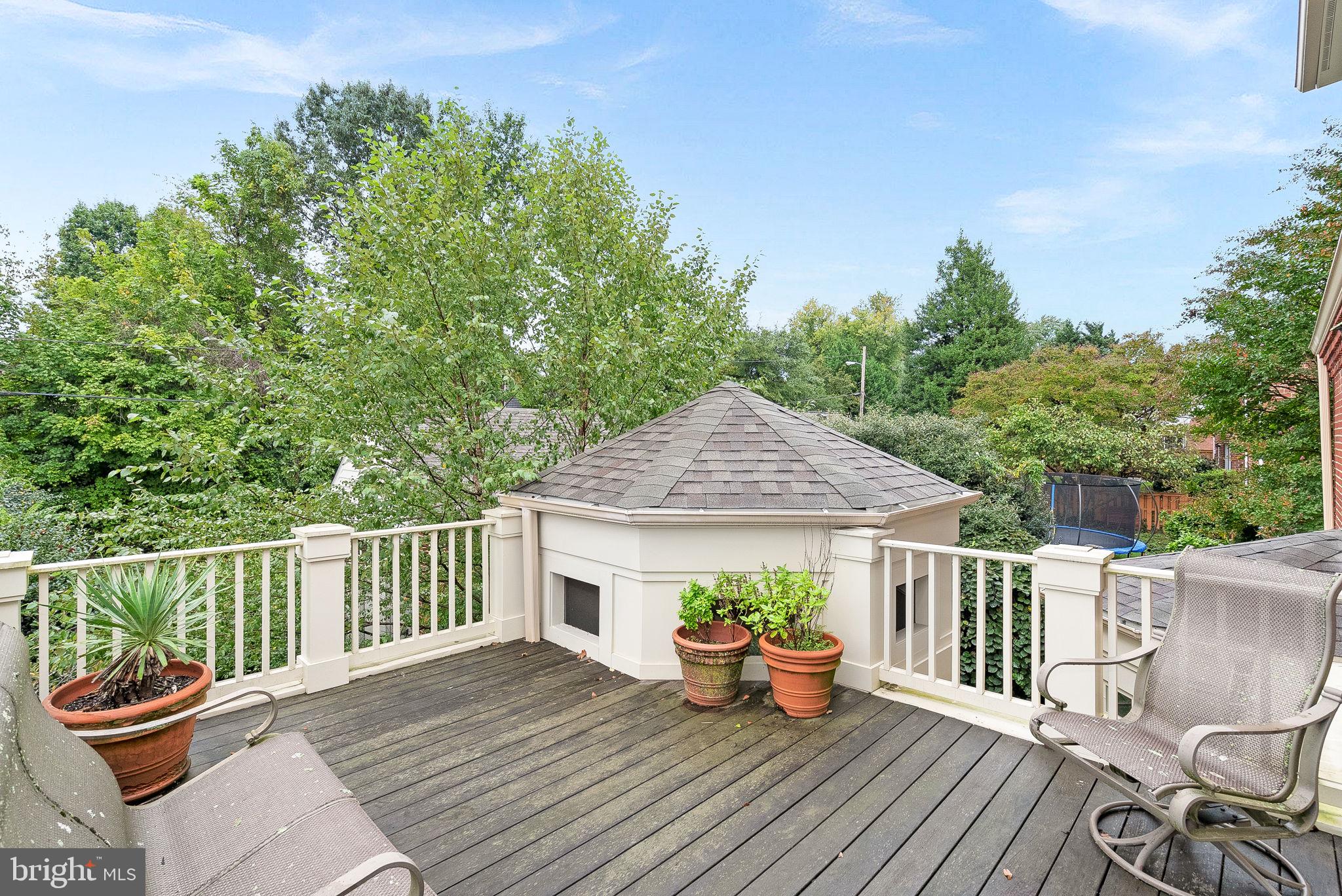 9314 Colesville Road Silver Spring, MD 20901 - Photo 24 of 88 a view of a table and chairs on the roof deck