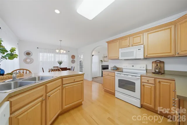 a bathroom with sink bathtub and next to a window