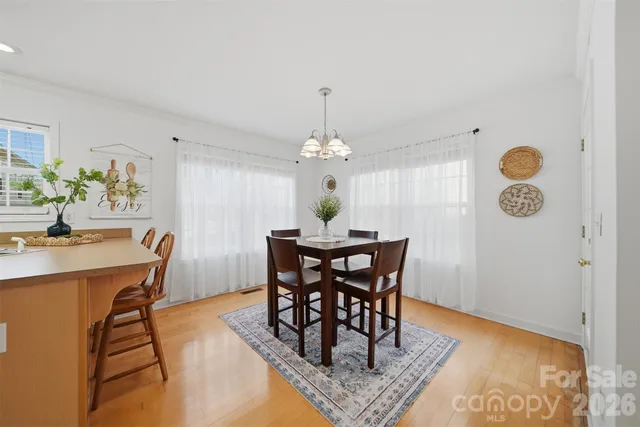 a view of a dining room that has a table and chairs