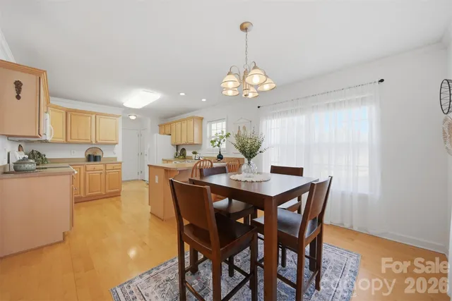 a kitchen with cabinets appliances a sink and a window