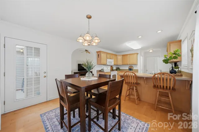 a kitchen with granite countertop a sink stove and cabinets