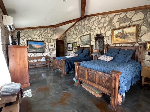 1815 Ranch To Market Road 2597 Sonora, TX 76950 - Photo 12 of 32 a bedroom with a bed and wooden floor