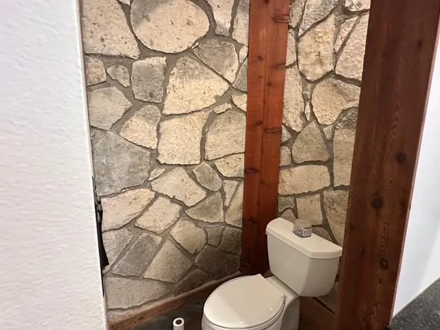 a view of a house with a backyard and a patio