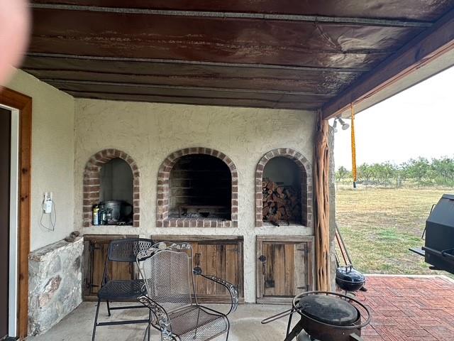 1815 Ranch To Market Road 2597 Sonora, TX 76950 - Photo 18 of 32 a view of a chairs and table in the balcony