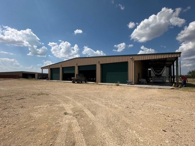 1815 Ranch To Market Road 2597 Sonora, TX 76950 - Photo 22 of 32 a view of a house with a yard and garage