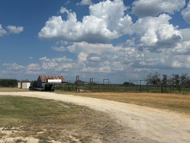 1815 Ranch To Market Road 2597 Sonora, TX 76950 - Photo 30 of 32 a view of a lake with houses in the background