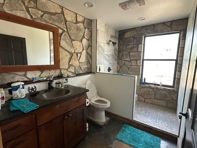 a bed sitting in a room next to a window