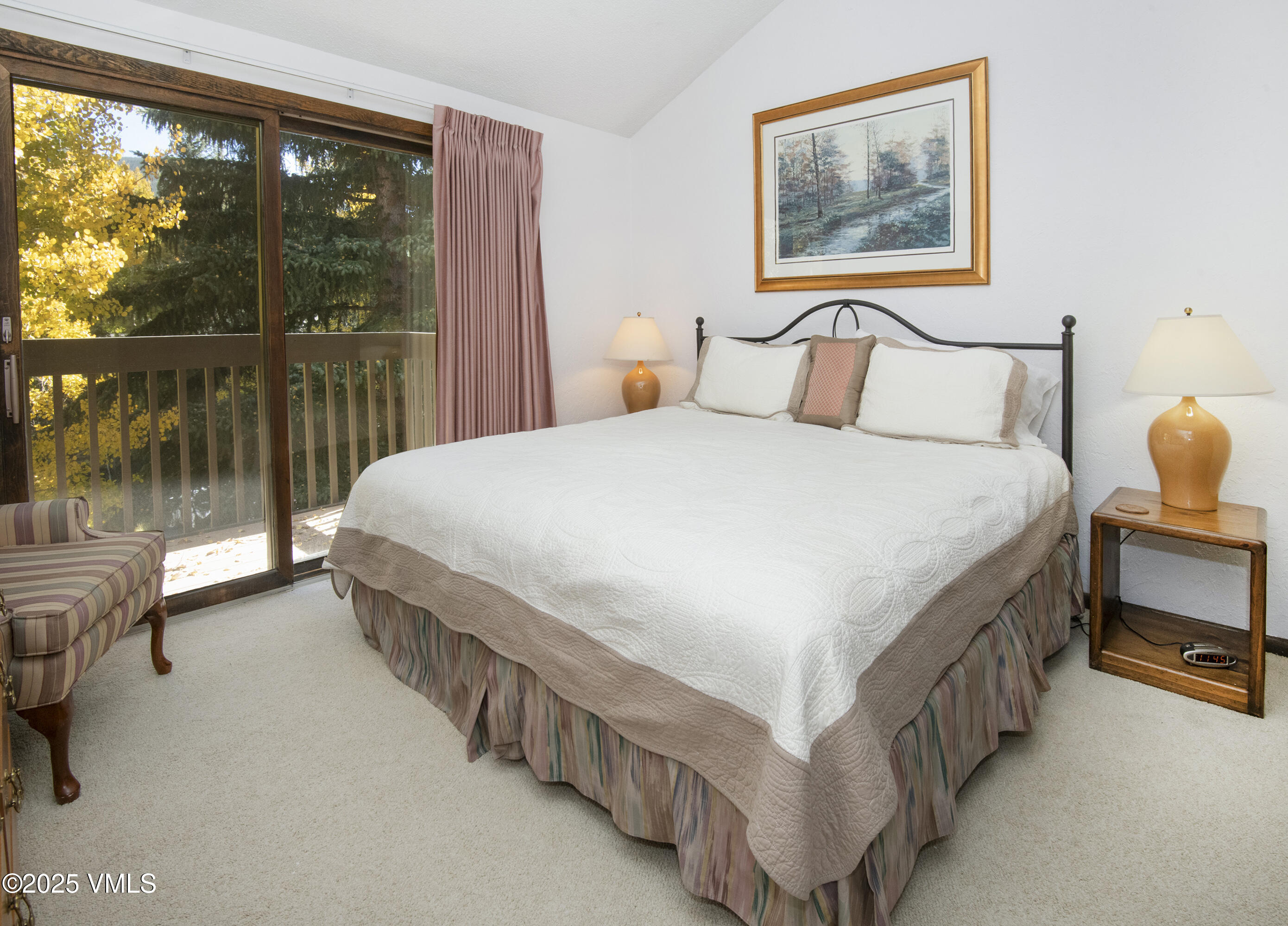 4516 Meadow Drive, Unit 807 Vail, CO 81657 - Photo 21 of 35 a bed sitting in a bedroom next to a window