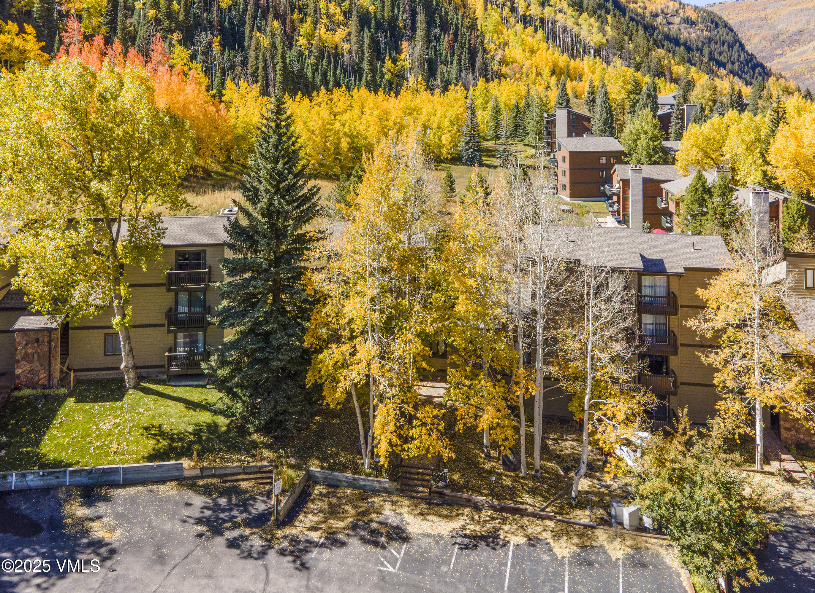 4516 Meadow Drive, Unit 807 Vail, CO 81657 - Photo 26 of 35 front view of a house with a yard