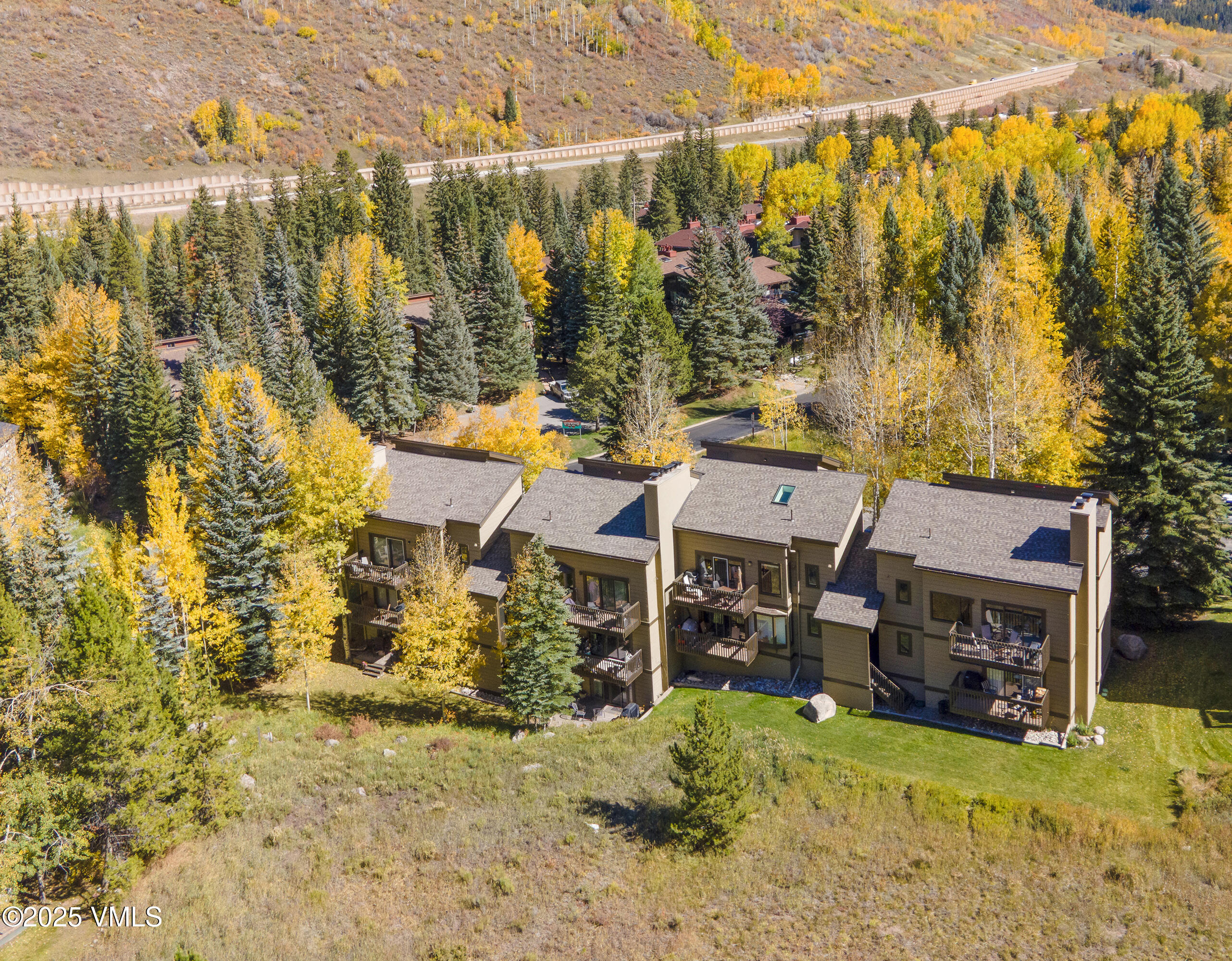 4516 Meadow Drive, Unit 807 Vail, CO 81657 - Photo 29 of 35 a view of a house with a yard and sitting area