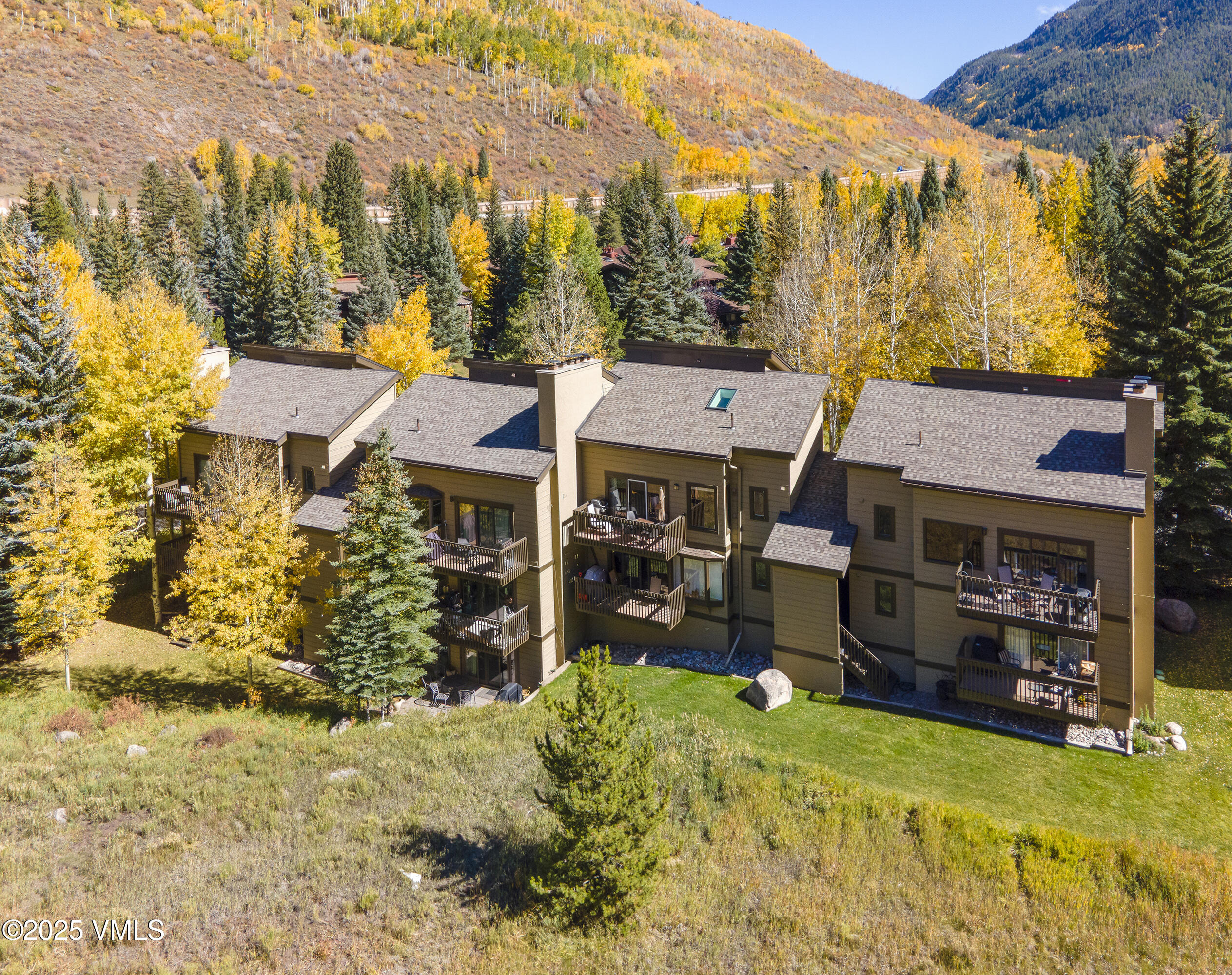 4516 Meadow Drive, Unit 807 Vail, CO 81657 - Photo 30 of 35 a view of a house with a yard and sitting area