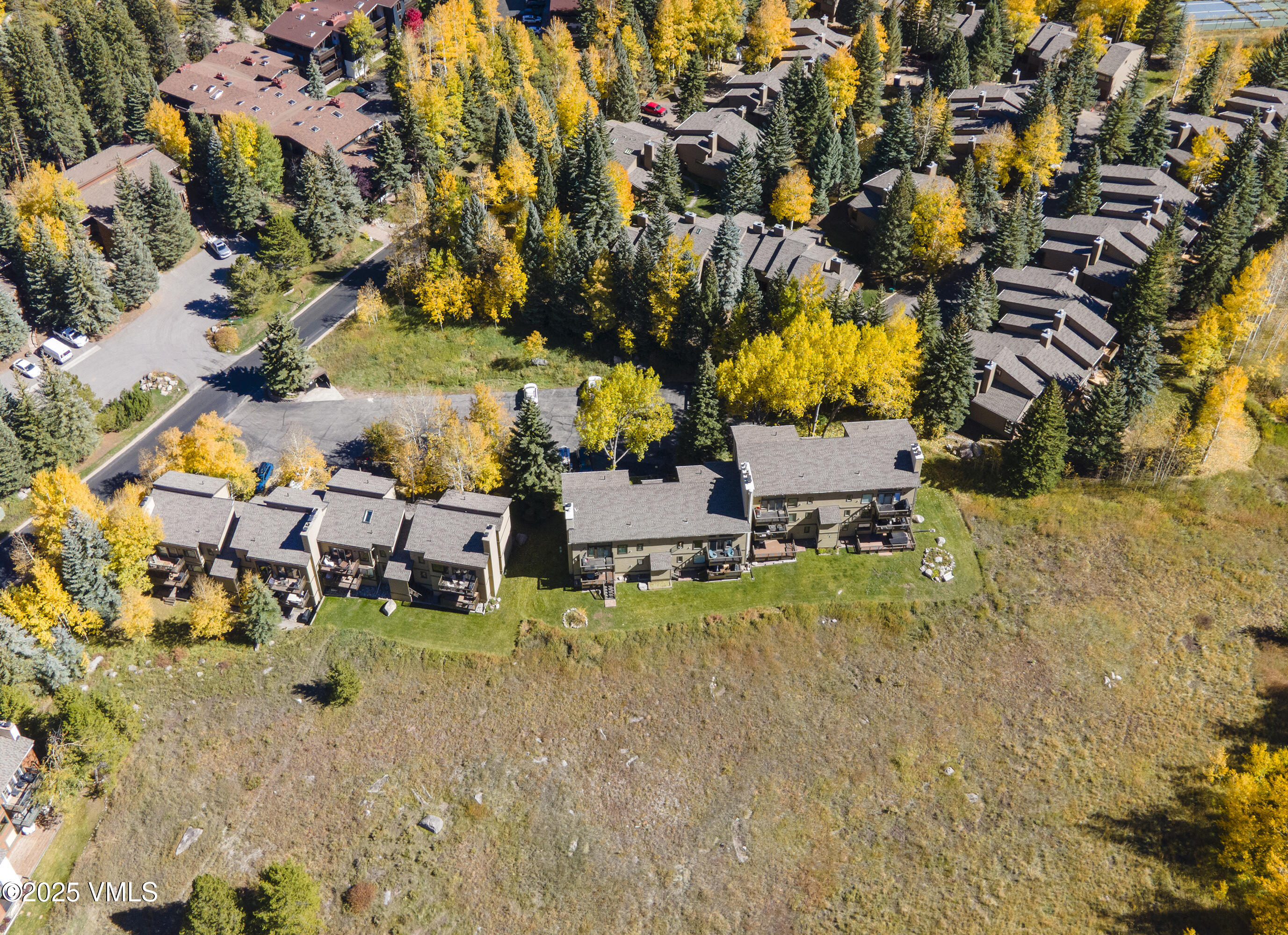 4516 Meadow Drive, Unit 807 Vail, CO 81657 - Photo 31 of 35 an aerial view of residential houses with yard