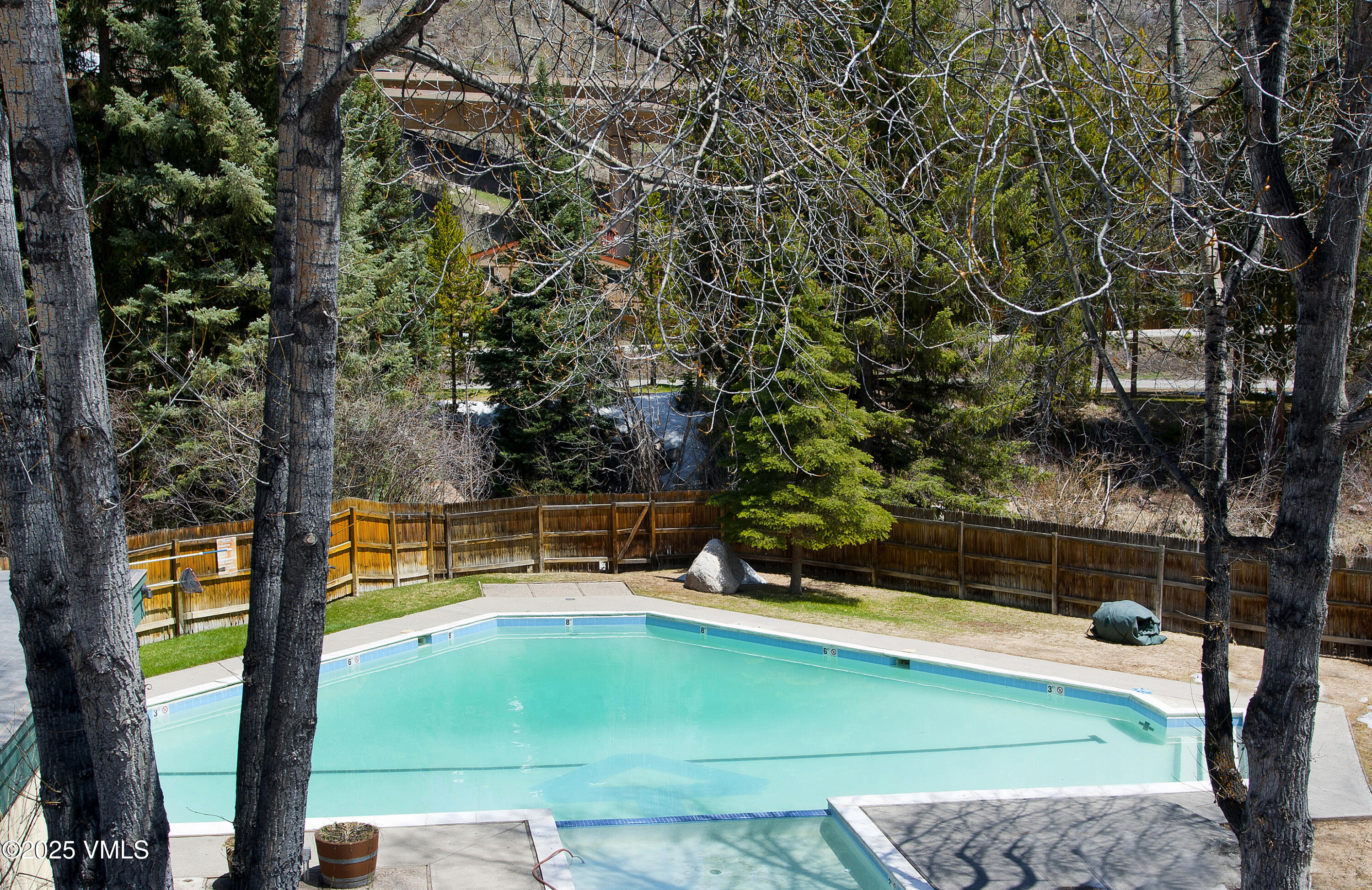 4516 Meadow Drive, Unit 807 Vail, CO 81657 - Photo 32 of 35 a view of a tennis ground with a large tree