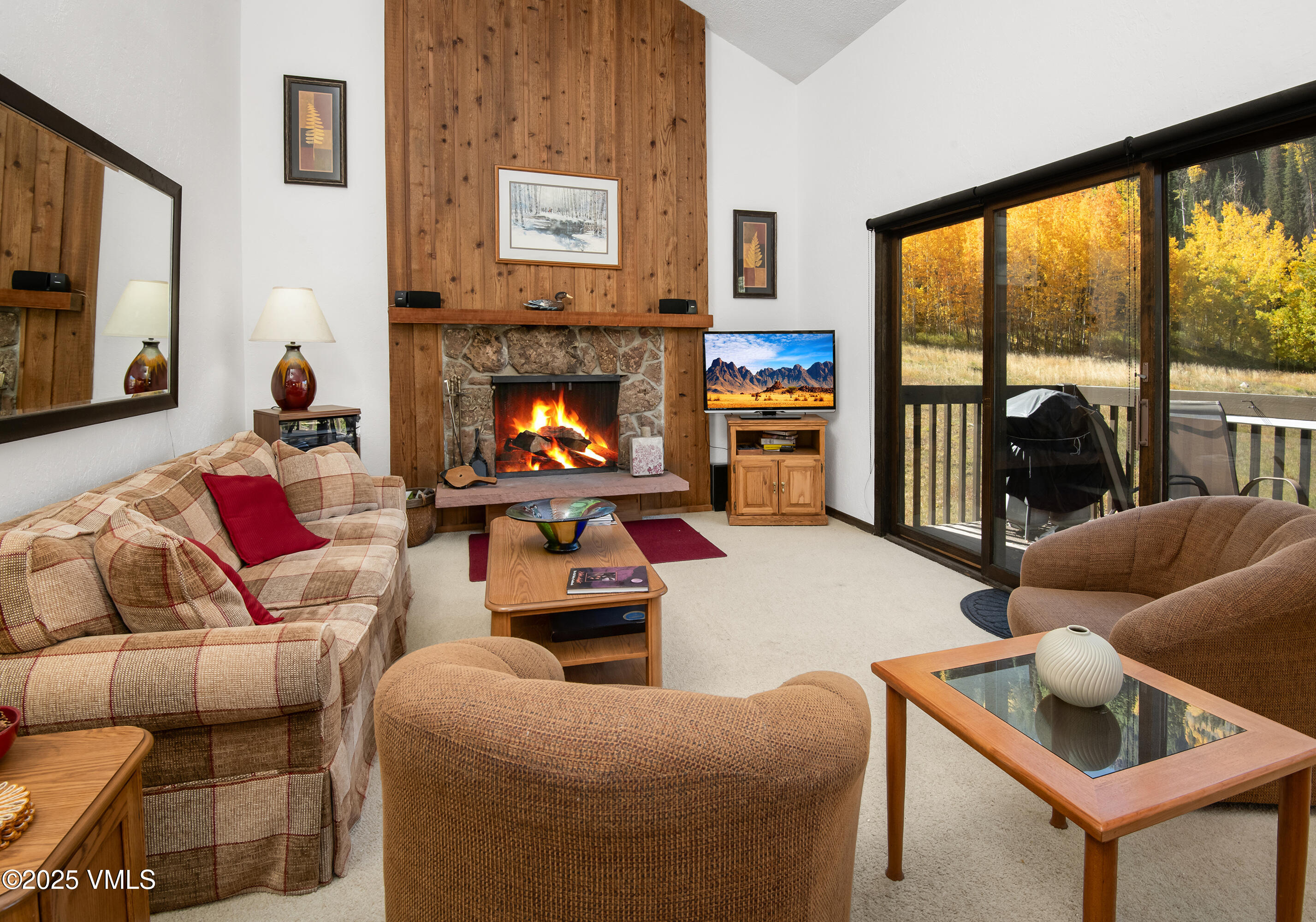 4516 Meadow Drive, Unit 807 Vail, CO 81657 - Photo 7 of 35 a living room with furniture and a fireplace