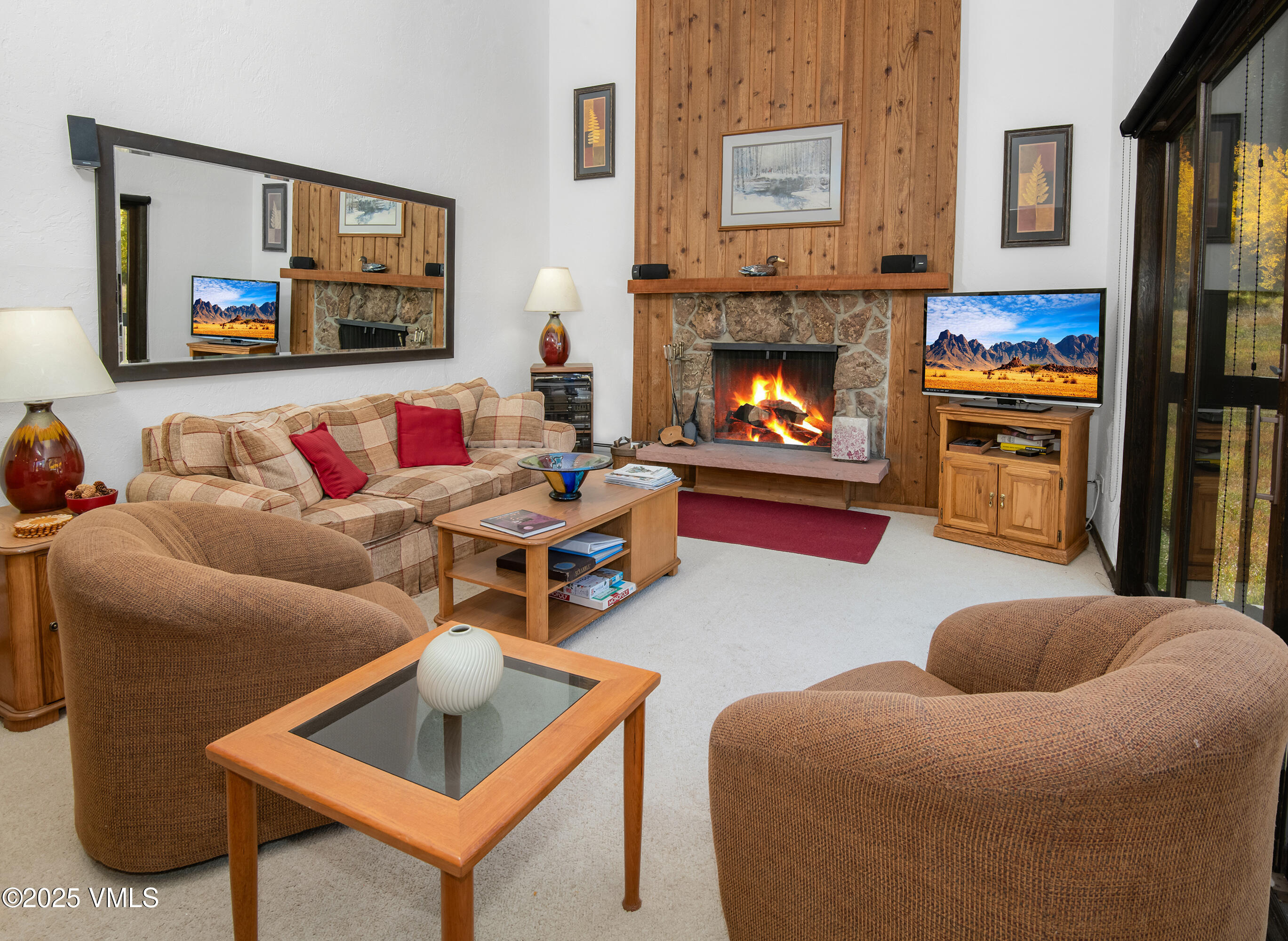 4516 Meadow Drive, Unit 807 Vail, CO 81657 - Photo 10 of 35 a living room with furniture and a fireplace