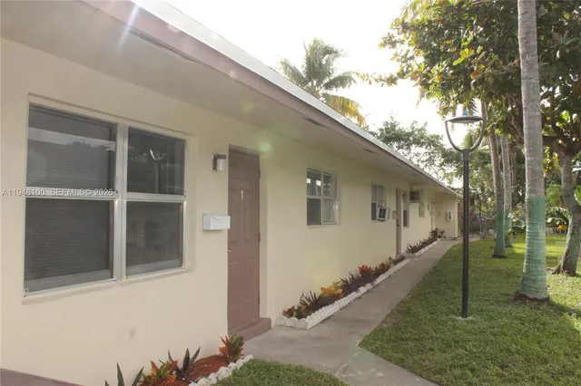 a house view with a backyard space