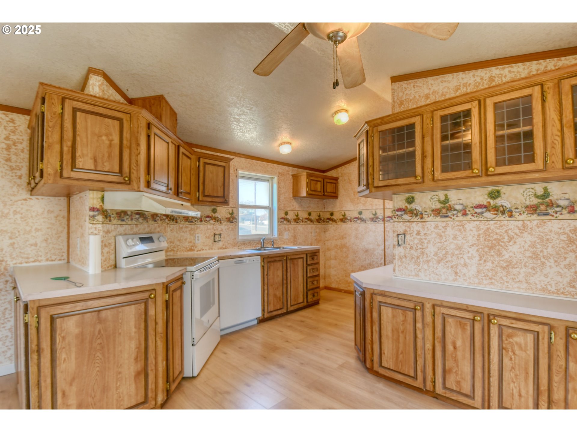 808 Southeast 10th Street Pendleton, OR 97801 - Photo 14 of 18 a kitchen with kitchen island granite countertop a sink stove and cabinets