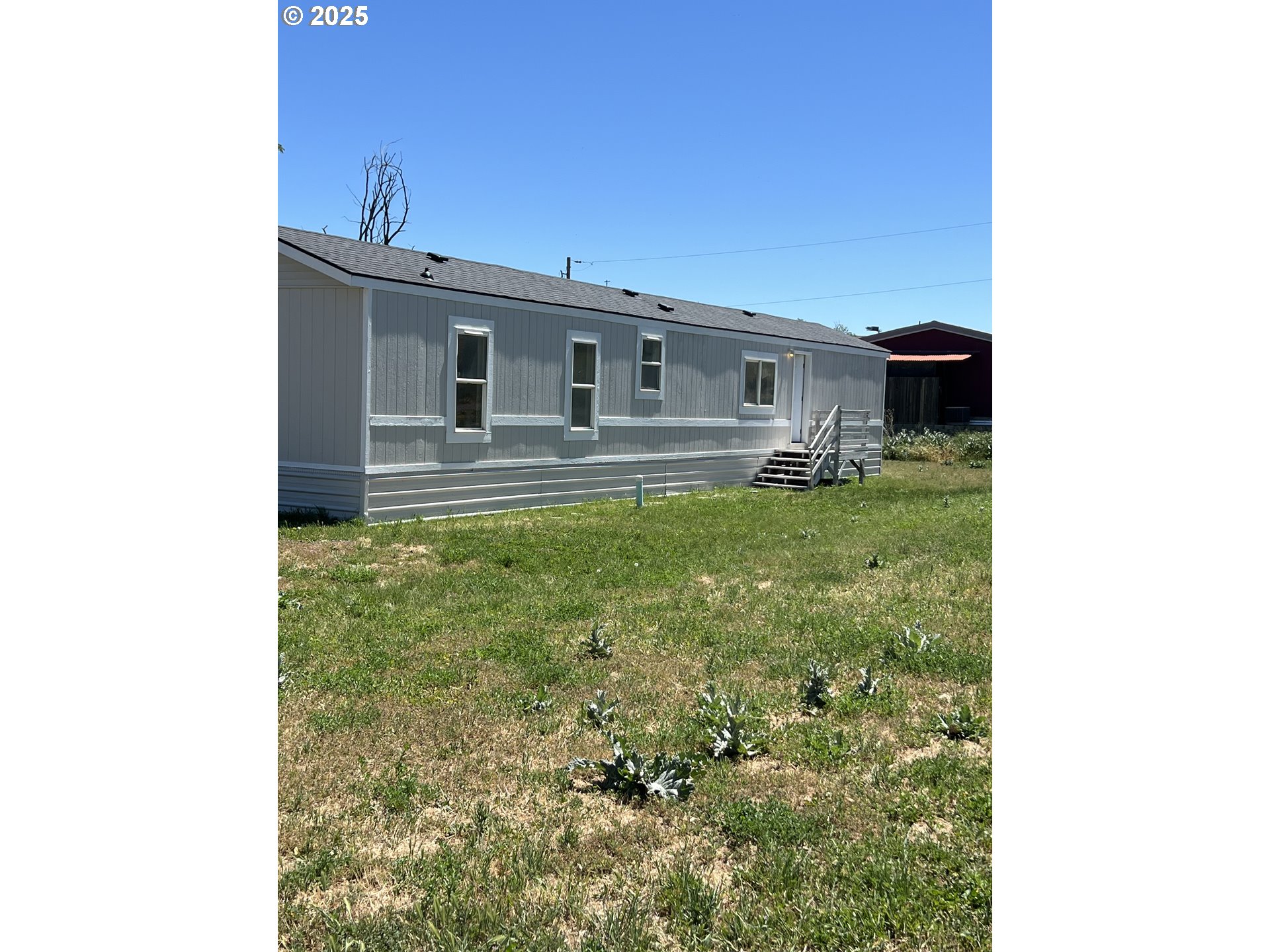 808 Southeast 10th Street Pendleton, OR 97801 - Photo 2 of 18 a backyard of a house with table and chairs