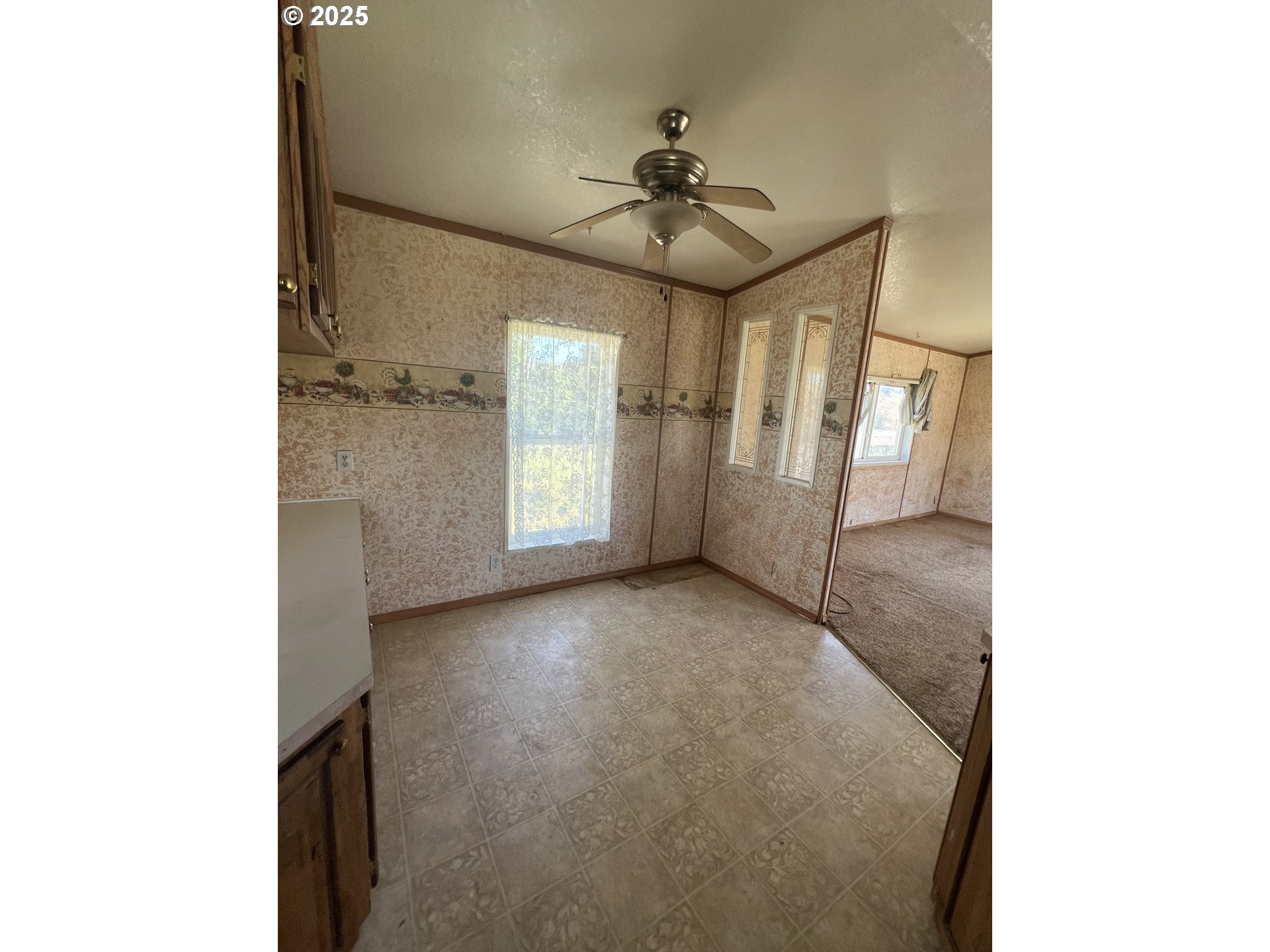 808 Southeast 10th Street Pendleton, OR 97801 - Photo 4 of 18 a view of an empty room with a window
