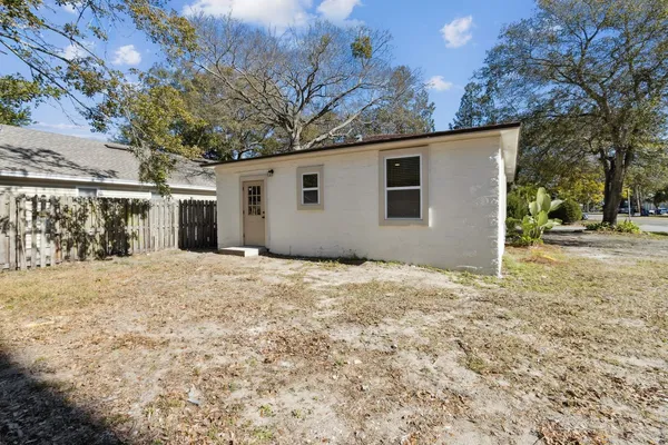 a view of a backyard of the house