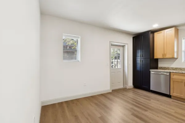 a view of an empty room with a window