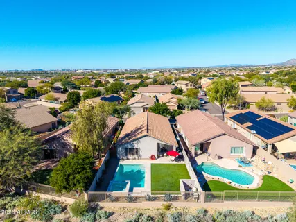 an aerial view of residential houses with outdoor space