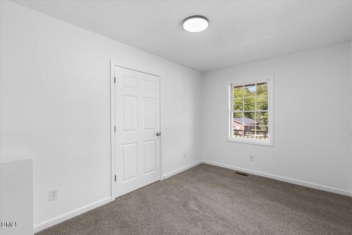 836 South Main Street Roxboro, NC 27573 - Photo 12 of 55 an empty room with a window
