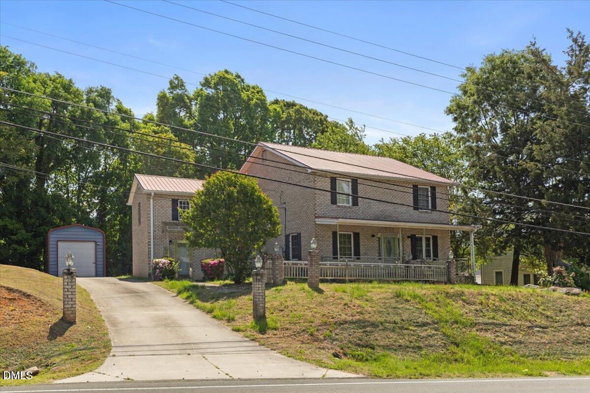 836 South Main Street Roxboro, NC 27573 - Photo 2 of 55 a front view of a house with garden