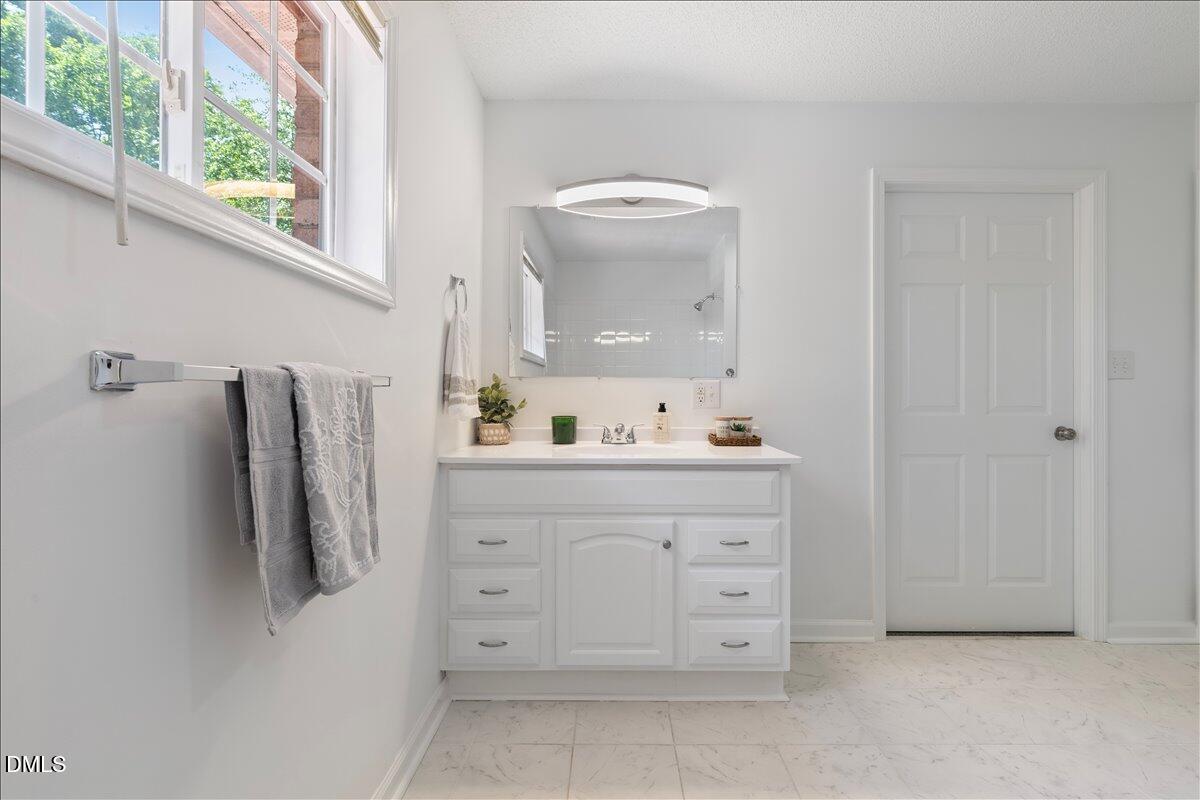 836 South Main Street Roxboro, NC 27573 - Photo 33 of 55 a bathroom with a sink vanity and mirror