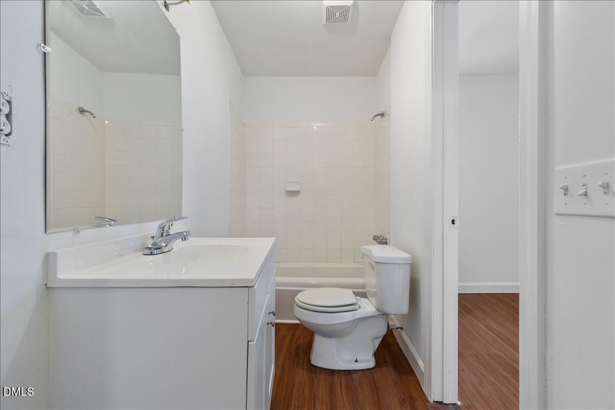 836 South Main Street Roxboro, NC 27573 - Photo 48 of 55 a bathroom with a sink toilet and a mirror