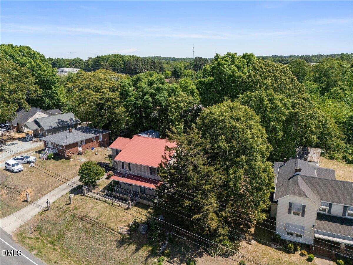 836 South Main Street Roxboro, NC 27573 - Photo 52 of 55 an aerial view of a house with a yard basket ball court and outdoor seating