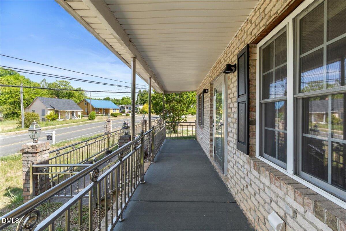 836 South Main Street Roxboro, NC 27573 - Photo 6 of 55 a view of a porch with wooden floor and outdoor space