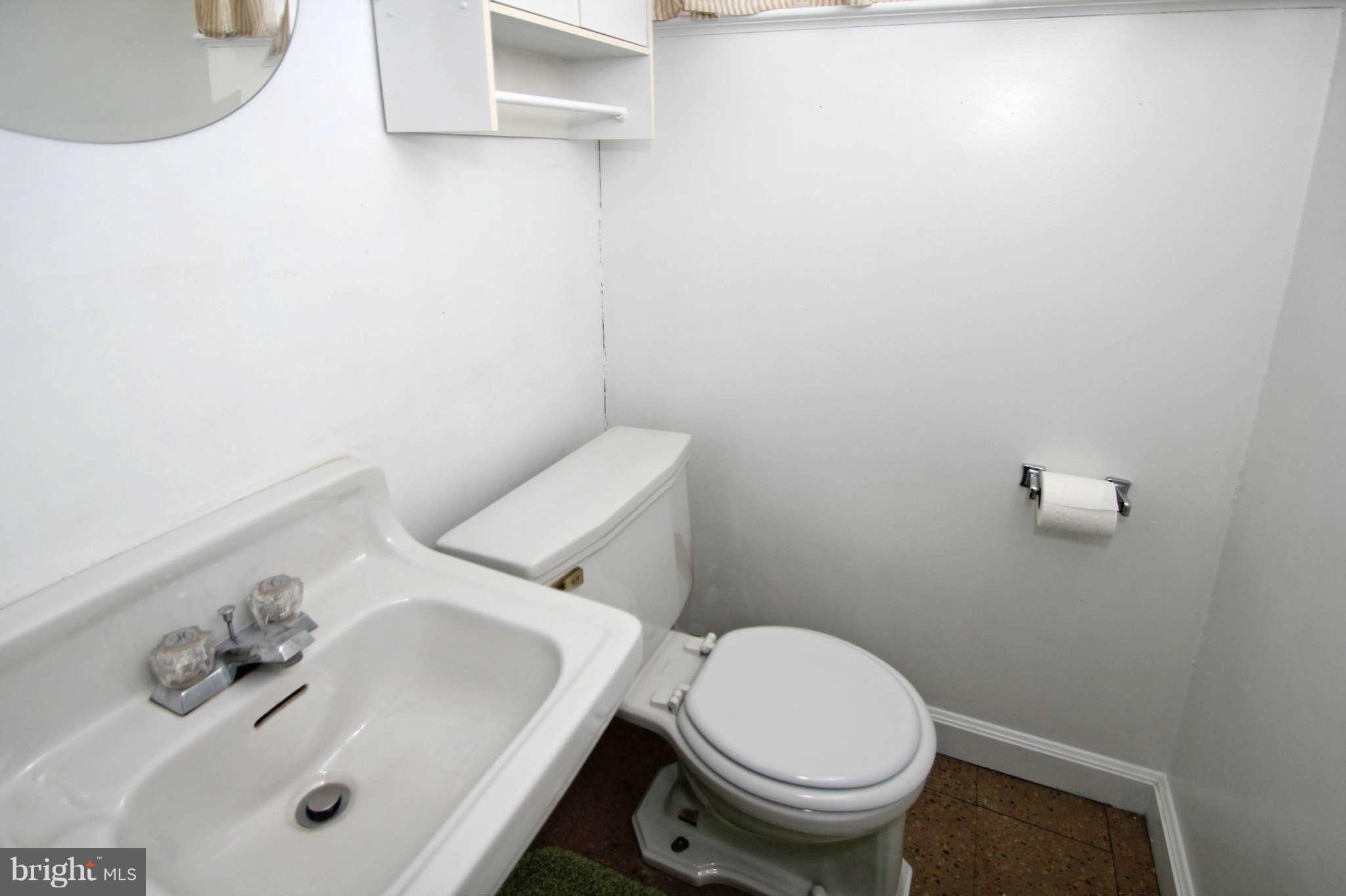 10711 Lombardy Road Silver Spring, MD 20901 - Photo 22 of 24 Lower level half bath - convenient to family room.