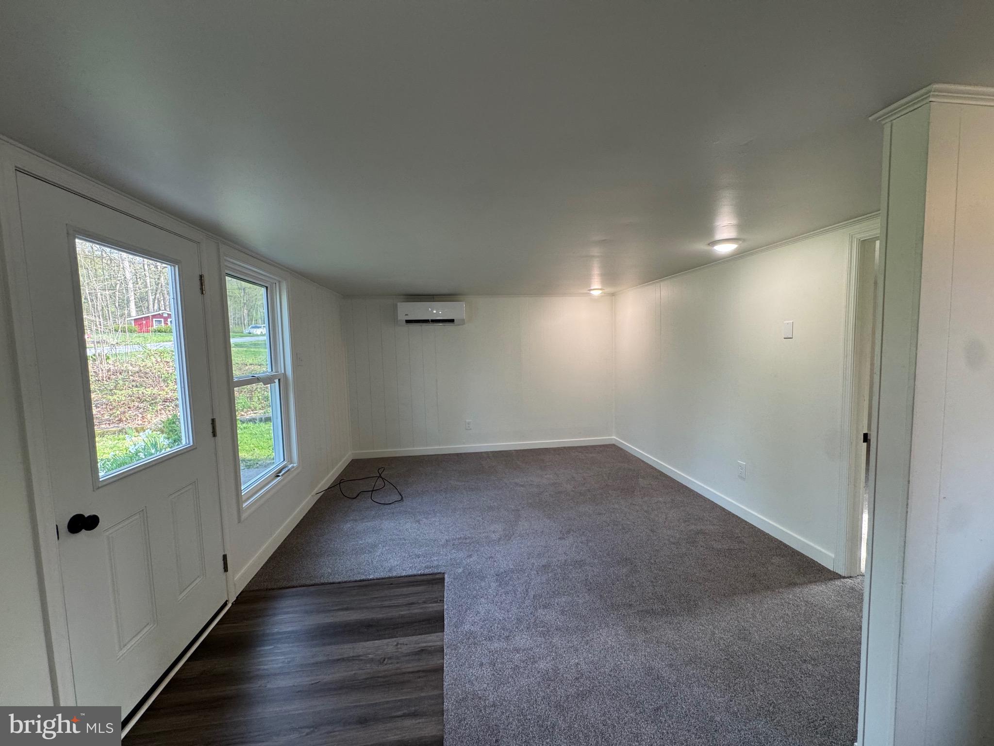 356 Keneagy Hill Road, Unit 20 Ronks, PA 17572 - Photo 4 of 7 an empty room with windows