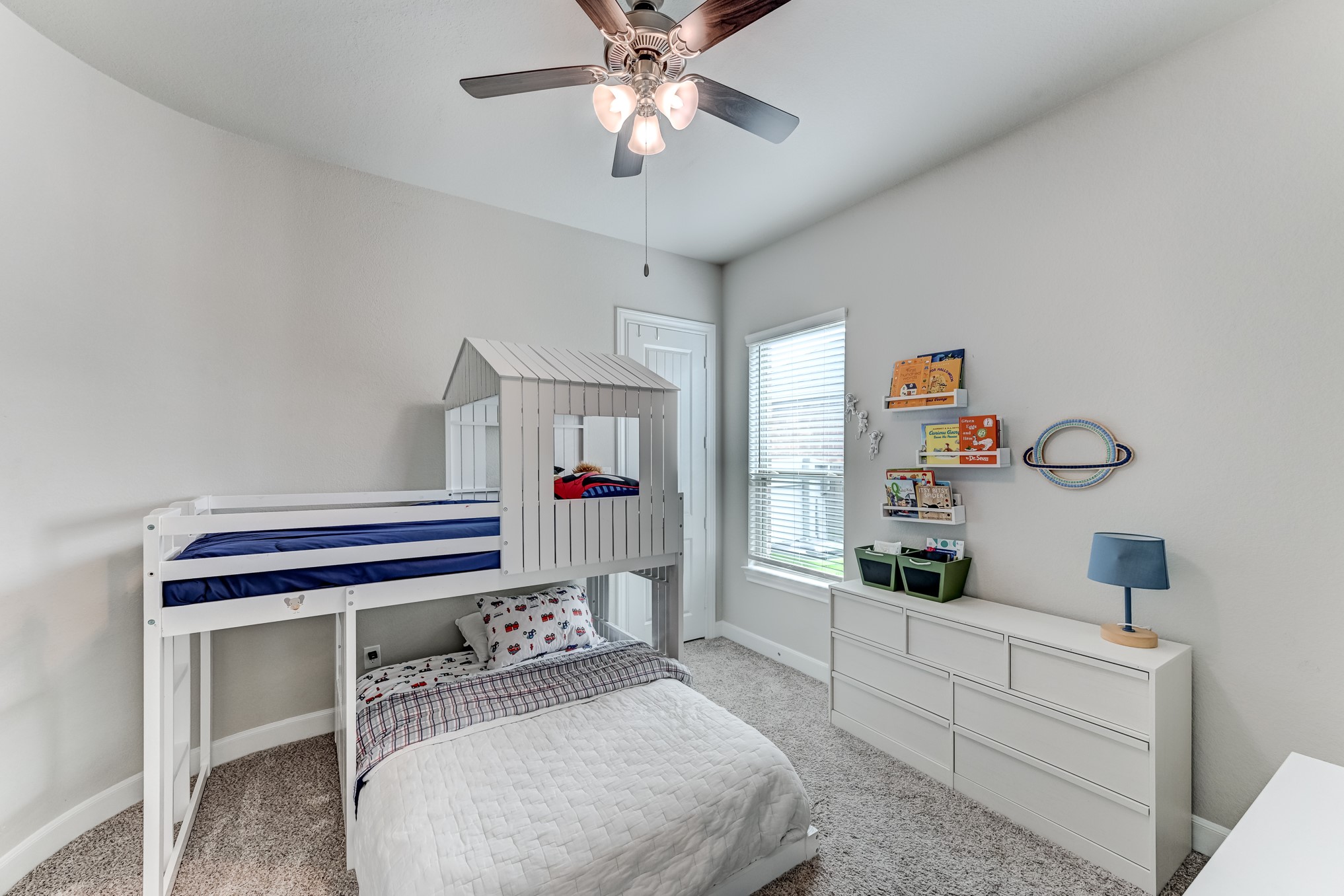 5806 Metaphor Way Rosenberg, TX 77469 - Photo 28 of 50 a bedroom with a bed and a bookshelf
