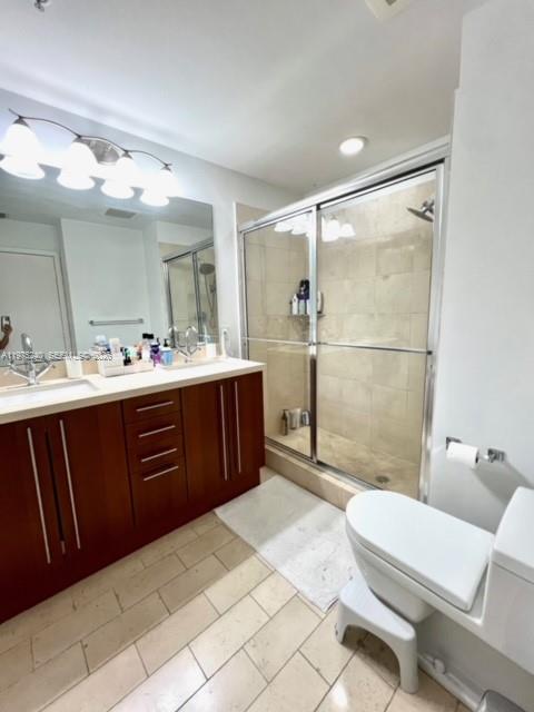 79 Southwest 12th Street, Unit 2010 Miami, FL 33130 - Photo 13 of 20 a bathroom with a sink a toilet and shower