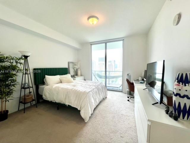 79 Southwest 12th Street, Unit 2010 Miami, FL 33130 - Photo 10 of 20 a bed room with a bed and a television