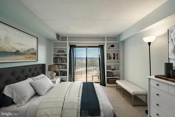 a bedroom with a large bed and a television