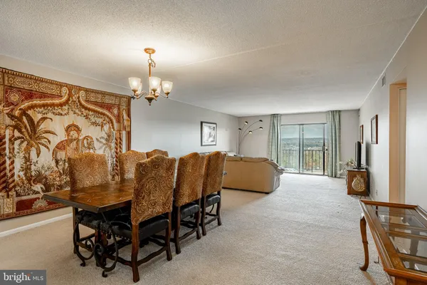 a dining room with furniture and window