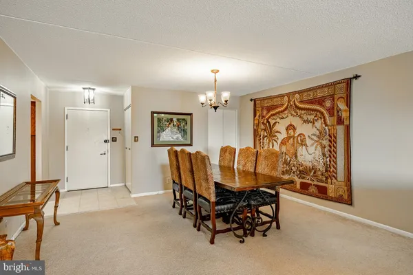 a view of a livingroom with furniture and a window