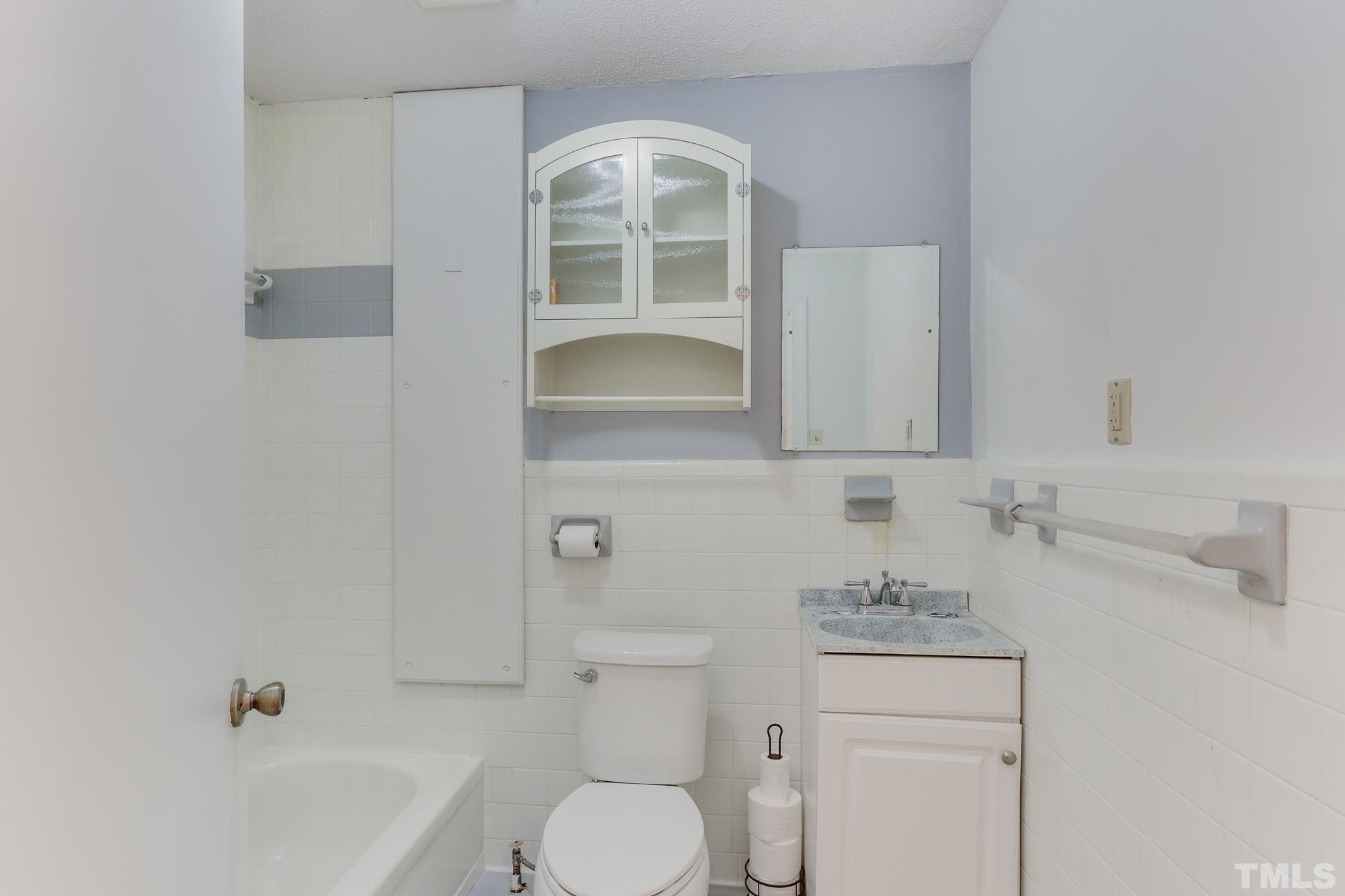 11723 Claude Lewis Road Middlesex, NC 27557 - Photo 20 of 27 a bathroom with a sink toilet and shower