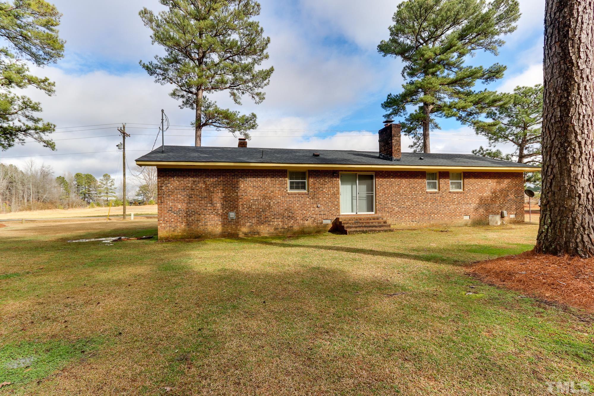 11723 Claude Lewis Road Middlesex, NC 27557 - Photo 25 of 27 a view of a house with a yard and a garage