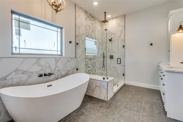 a spacious bathroom with a double vanity sink mirror double and shower