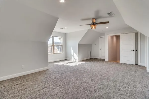 an empty room with a empty space and windows