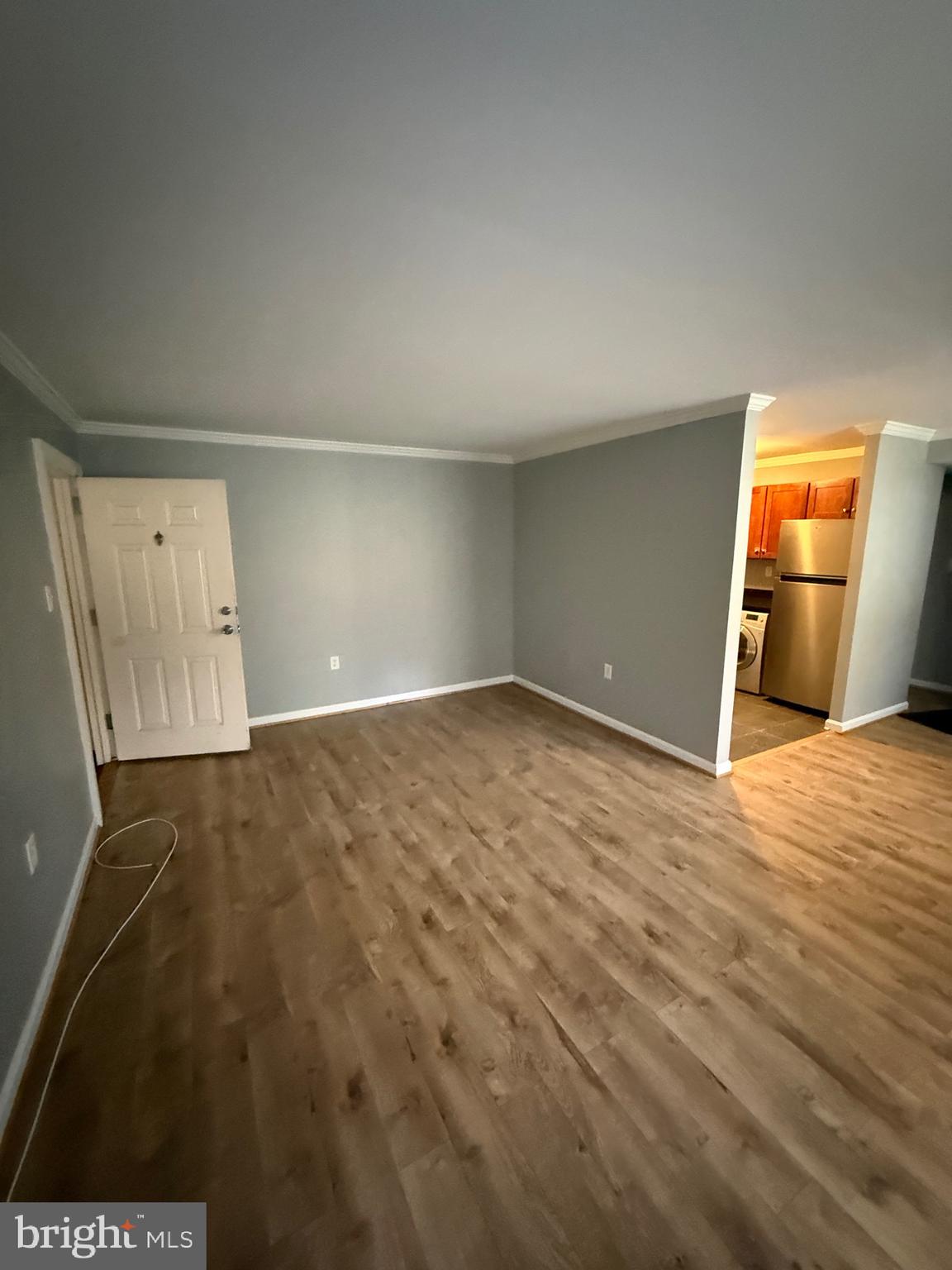 3101 Naylor Road Southeast, Unit 104 Washington, DC 20020 - Photo 11 of 13 an empty room with wooden floor and closet