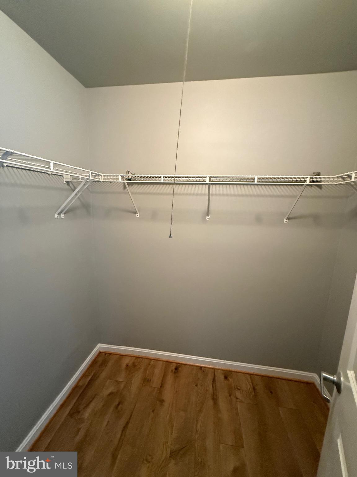 3101 Naylor Road Southeast, Unit 104 Washington, DC 20020 - Photo 5 of 13 a view of a room with racks on the wall